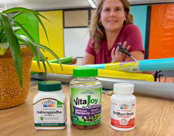 Picture of teacher and supplement bottles