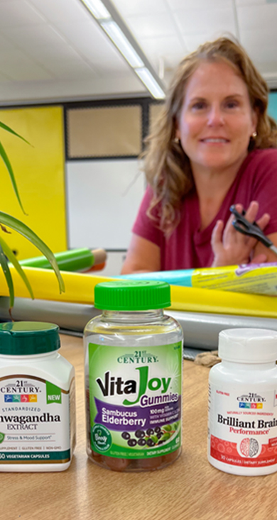 Picture of teacher and supplement bottles