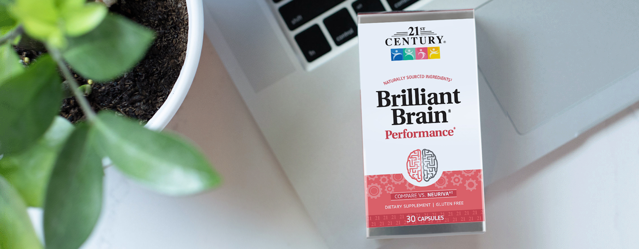 A box of 21st Century's Brilliant Brain sitting on a crossword puzzle.