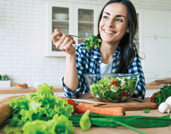 Picture of Woman eating leafy greens