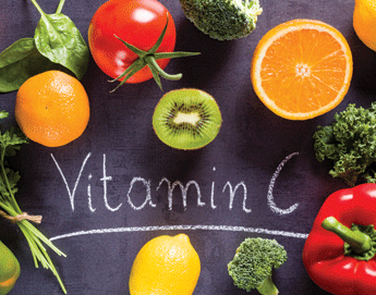 A top view of oranges, kiwi, tomato, broccoli, lemon, and red pepper next to text that says Vitamin C.