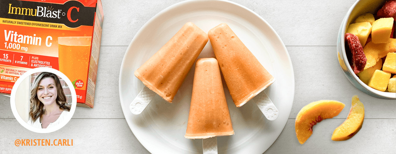 Box of ImmuBlast-C next to fresh peaches and popsicles on a plate