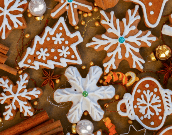 Assorted healthy chirstmas cookies on wood counter.