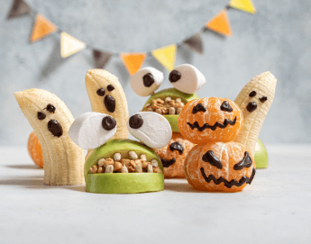 Scary halloween ghost treats made from apples and bananas