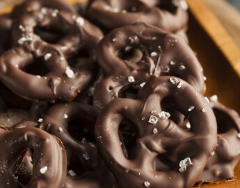 A delicious stack of chocolate covered pretzels.