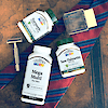 A group shot with a bottle of 21st Century Saw Palmetto 450 mg vegetarian capsules, Mega Multi Mens and Turmeric 500 mg Complex with a tie and men's razor.